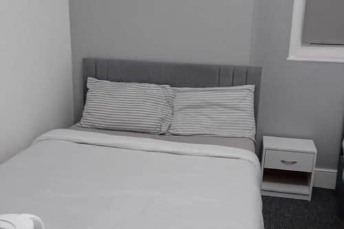 Family Triple Room, Non Smoking, Private Bathroom | Desk, laptop workspace, blackout drapes, iron/ironing board