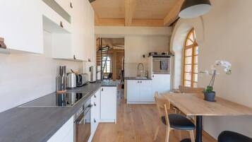 Apartment | Private kitchen | High chair, cleaning supplies