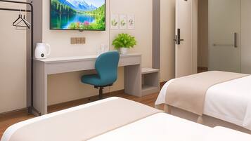 A hotel room with two beds, a desk, a chair, a TV, and a wardrobe.