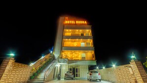 A multi-story hotel named "HOTEL RUDRA" with a visible entrance and a staircase leading to the upper floors. - Hotel Rudra (Rishikesh)