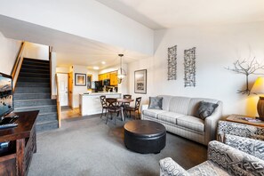 TV, fireplace - Welcoming 2-bedroom condo featuring an updated walk-in shower. (Fish Creek)