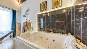 Shower, hair dryer, towels, toilet paper