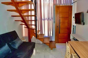 Living area - Charming 1-bedroom apartment steps to the Beach Jaguaruna with AC (Jaguaruna)