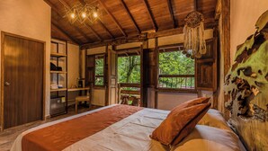 A bedroom with a large bed, wooden ceiling, and a view of the outdoors. - ECOHOTEL PIEDEMONTE (Salento)