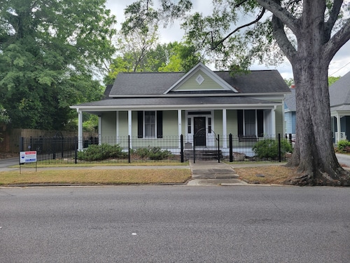 Lovely fenced and gated 3-bed/ 2 bath home on beautiful Elm lined Main Street.