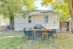 A house with a patio area featuring a grill and outdoor seating. - Nest & Nook • 2 Units, 2 Mins from BYU (Provo)