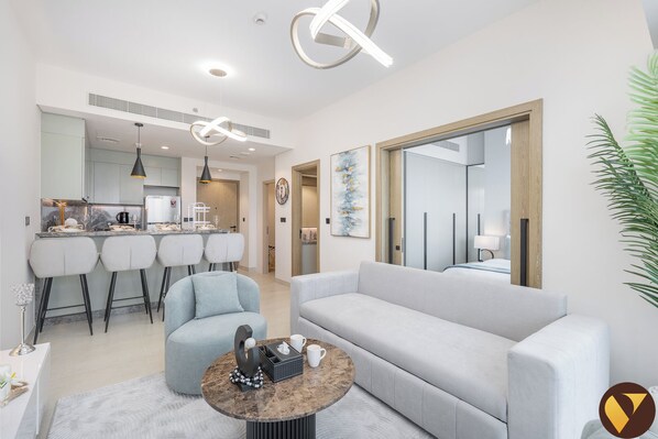 Luxury Apartment, Balcony, City View | Living area | 65-inch Smart TV with satellite channels