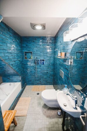 Shower, hair dryer, towels, soap