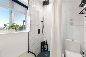 Shower, hair dryer, towels, soap