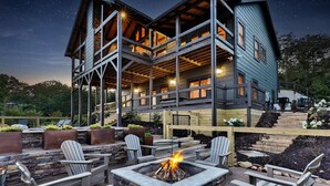 A multi-story building with outdoor seating and a fire pit. - Toccoa Vista Pool & Spa |Mineral Bluff, GA (Mineral Bluff)