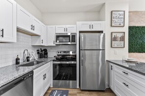 Microwave, oven, stovetop, dishwasher - Modern 4BR/4BA Escape • 10 Min to Downtown ATL (Atlanta)