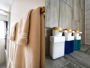 Shower, hair dryer, towels, soap