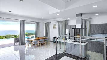 Luxury Villa, Sea View | Living area | 86-inch Smart TV with digital channels, fireplace, Netflix