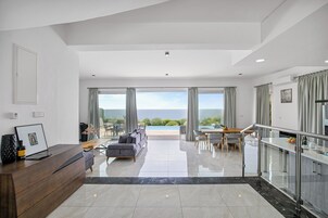Luxury Villa, Sea View | Living area | 86-inch Smart TV with digital channels, fireplace, Netflix