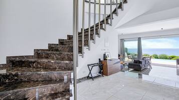 Luxury Villa, Sea View | Living area | 86-inch Smart TV with digital channels, fireplace, Netflix