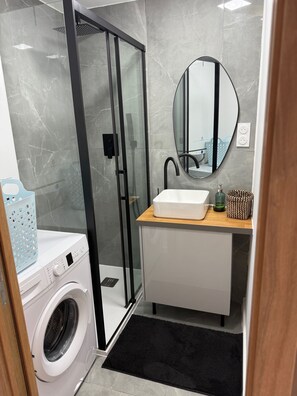 Shower, hair dryer, towels, soap