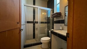 Shower, towels, soap, toilet paper