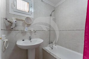 A bathroom with a sink, mirror, and shower. - Beatifull Apartam 14A 2 Bedroom Sea Medano (Granadilla de Abona)