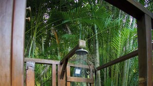 A wooden gate leading to a shower area with a stone floor and a tropical backdrop. - New! Luxurious villa with pool and exceptional view of the Caribbean (Deshaies)