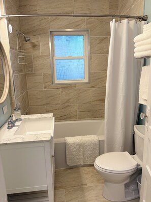Shower, hair dryer, towels, soap