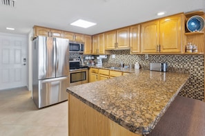 Fridge, microwave, oven, stovetop - Beachfront Comfort w/ Pool, Balcony & Steps to Flagler Avenue (New Smyrna Beach)