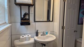 Shower, towels, soap, toilet paper