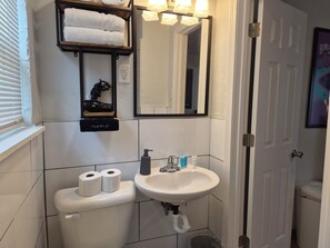 Shower, towels, soap, toilet paper