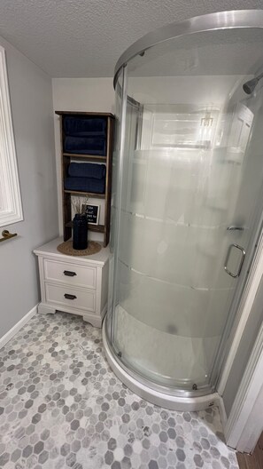 Shower, hair dryer, towels, soap