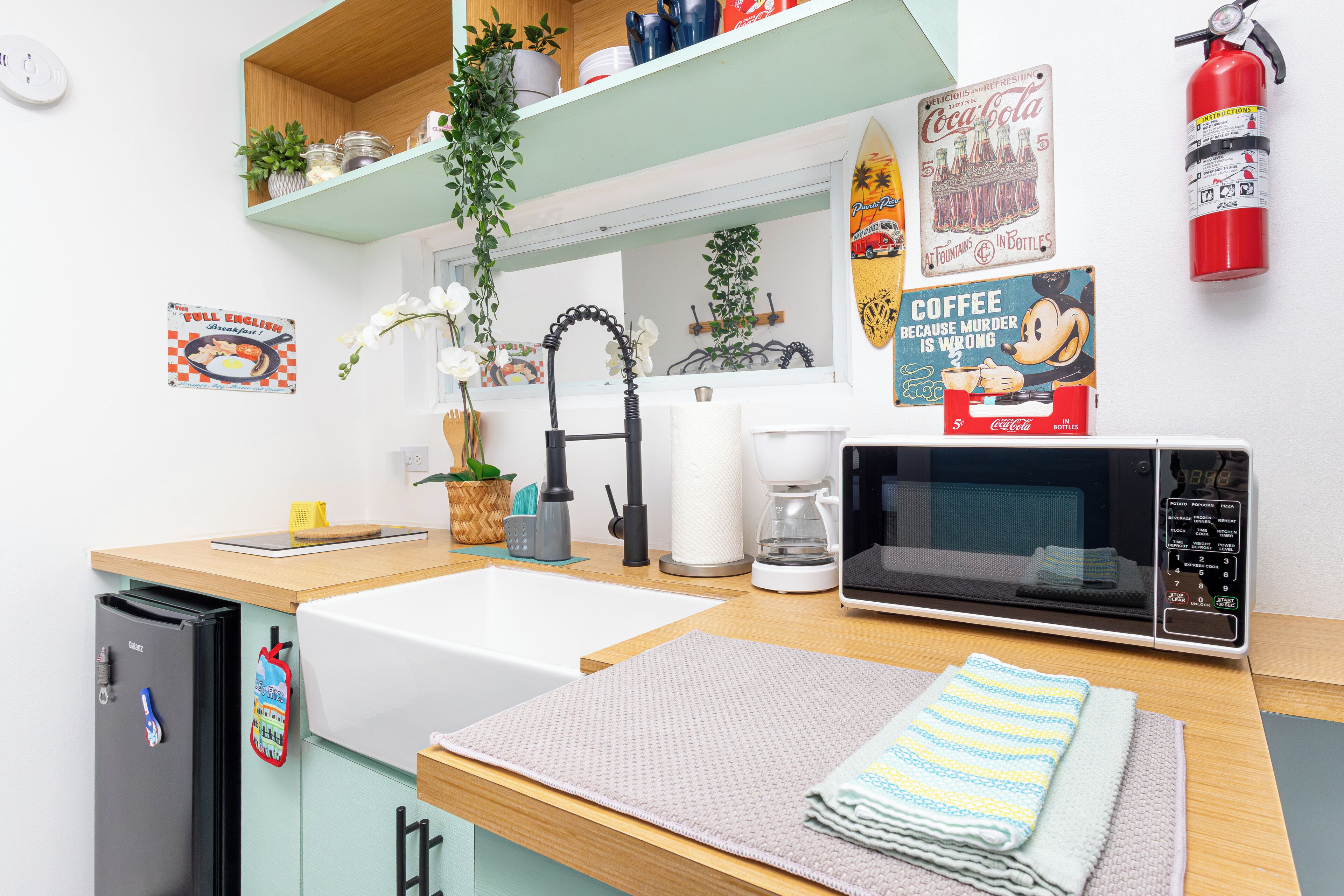 Microwave, coffee/tea maker, cookware/dishes/utensils, dining tables
