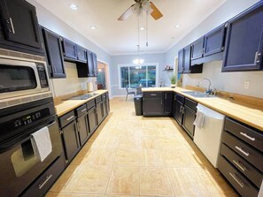 Fridge, microwave, oven, stovetop - Spacious 4-Bedroom Retreat with Game Room and Backyard BBQ (Memphis)