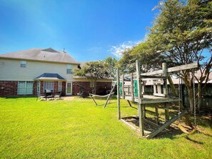 Children's area - Spacious 4BR Retreat with BBQ, Hammock, and Outdoor Lounge (Cordova)