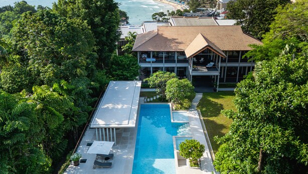 A large house with a swimming pool, surrounded by lush greenery and overlooking a beach. - Princess Maria - 6BR seaview villa in guarded estate, 250m from Kata Noi Beach (Tambon Karon)