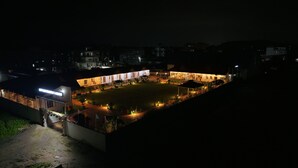 A large, well-lit building with multiple rooms and a spacious courtyard. - LUIT BLUE HOMESTAY & RESORTS (Guwahati)