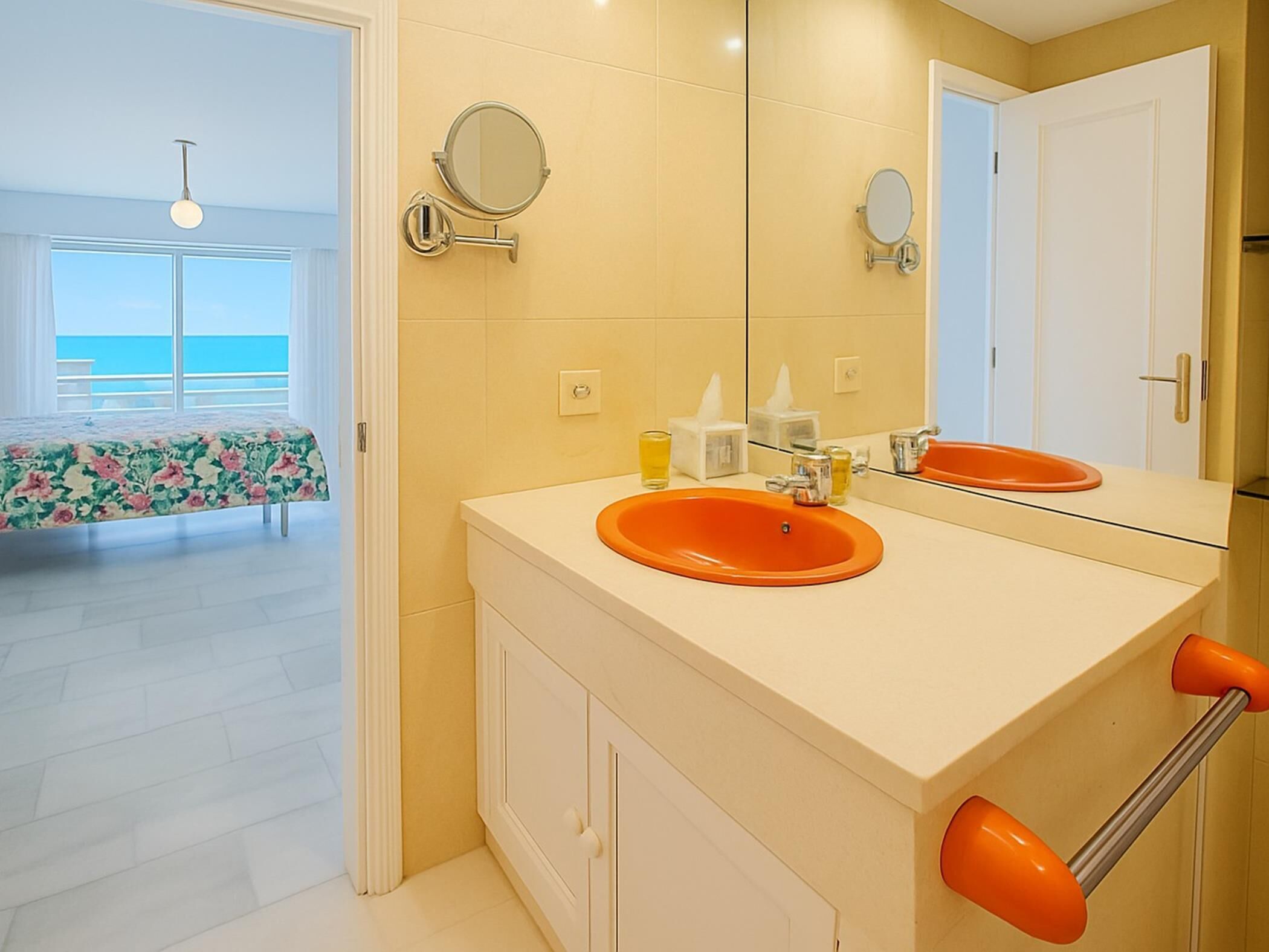A bathroom with two sinks, a mirror, and a towel rack.