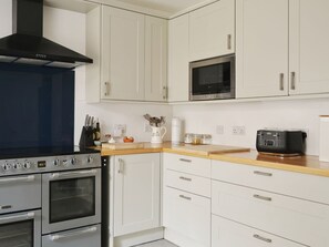 Fridge, microwave, oven, cookware/dishes/utensils