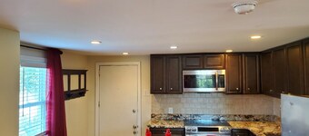 Adorable cottage in lovely gated property on beautiful Elm lined main street