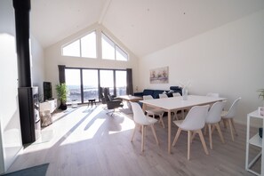 Dining - New vacation home by the sea with glass front, fireplace & boat. Pet friendly (Agder)