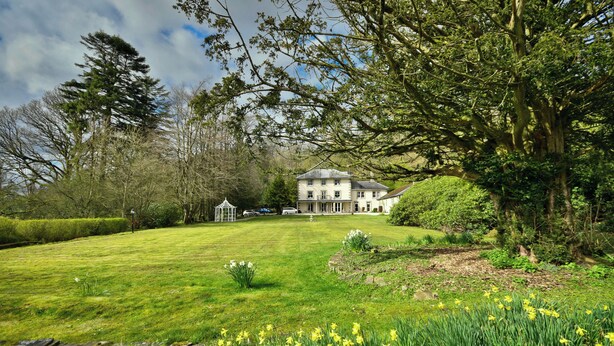 A large, white house with a spacious lawn and a gazebo. - Lovelady Shield House (Alston)