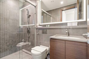 Shower, hair dryer, towels, shampoo