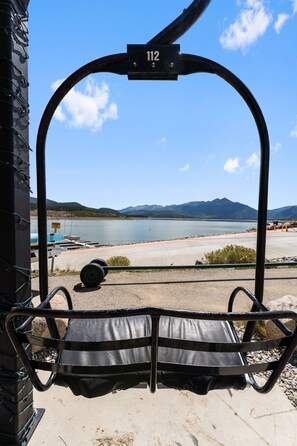 A chairlift with a view of a lake and mountains. - Steps from Lake Dillon & Amphitheater - Central to 3 World-Class Ski Resorts! (Dillon)