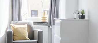 Perfect for solo travelers looking for a simple and budget-friendly base. This cozy room comes with a TV and workspace, and you’ll have access to a shared kitchen and shared bathroom.