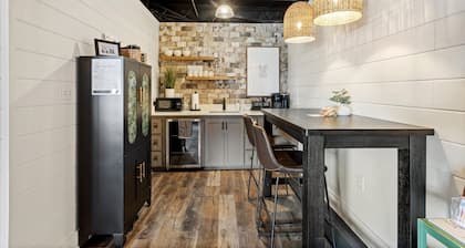 Water Street Retreat is a cozy dog-friendly studio in downtown Biloxi, steps from beaches, casinos & dining. Features a king bed, sofa bed, kitchenette, modern bath, Wi-Fi & easy parking—perfect for exploring the coast.