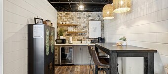 Water Street Retreat is a cozy dog-friendly studio in downtown Biloxi, steps from beaches, casinos & dining. Features a king bed, sofa bed, kitchenette, modern bath, Wi-Fi & easy parking—perfect for exploring the coast.