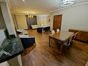 Family Apartment, City View | In-room safe, desk, laptop workspace, blackout drapes