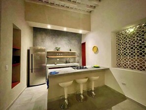 Fridge, coffee/tea maker, cookware/dishes/utensils