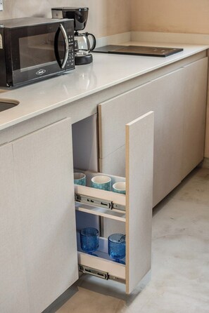 Fridge, microwave, stovetop, coffee/tea maker