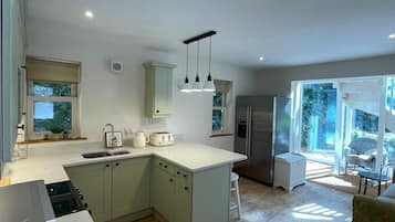 Family Apartment, Patio, Garden View | Private kitchen | Full-sized fridge, microwave, oven, stovetop