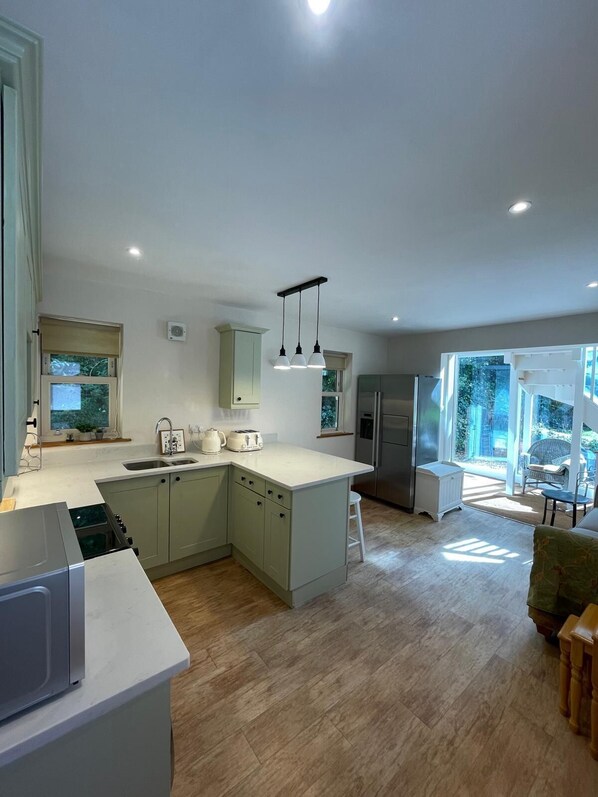 Family Apartment, Patio, Garden View | Private kitchen | Full-size fridge, microwave, oven, stovetop
