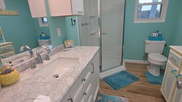 Shower, hair dryer, towels, soap
