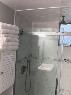 Shower, hair dryer, towels, soap